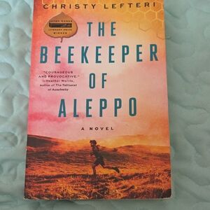The Beekeeper of Aleppo — Paperback Novel in Orange and Blue